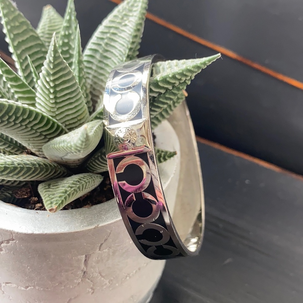 authentic Coach bangle. Black and stainless.